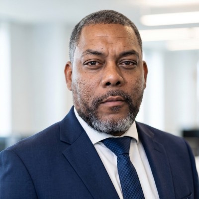 Professional headshot of Dwain Prendergast